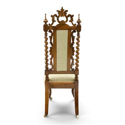Victorian carved walnut side chair, the ornate high back with pierced and carved scrolled cartouche cresting rail, the back panel and sprung seat upholstered in sage green fabric, flanked by scrolling acanthus leaves and spiral turned pilasters, raised on scroll carved cabriole legs with ceramic castors