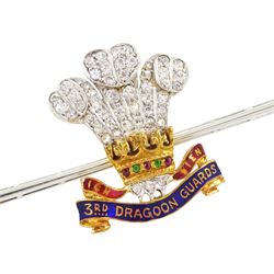 Early 20th century gold and palladium 3rd Dragoon Guards, multi gemstone set brooch, the Prince of Wales crest set with old cut and rose cut diamond ostrich feathers, garnet and ruby coronet and enamelled logo, in silk and velvet lined case by Harrods of London 