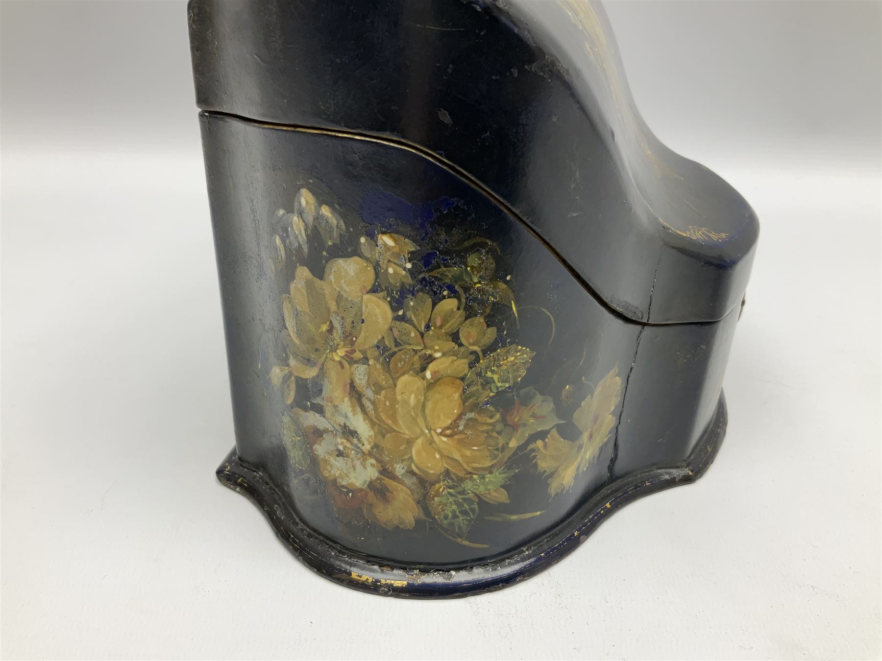 Victorian papier-mâché stationary box, of rounded wedge form with mother of pearl escutcheon, the hinged and curved cover and sides hand painted with floral sprays, opening to reveal a lined and fitted interior, H15cm L22cm D16cm