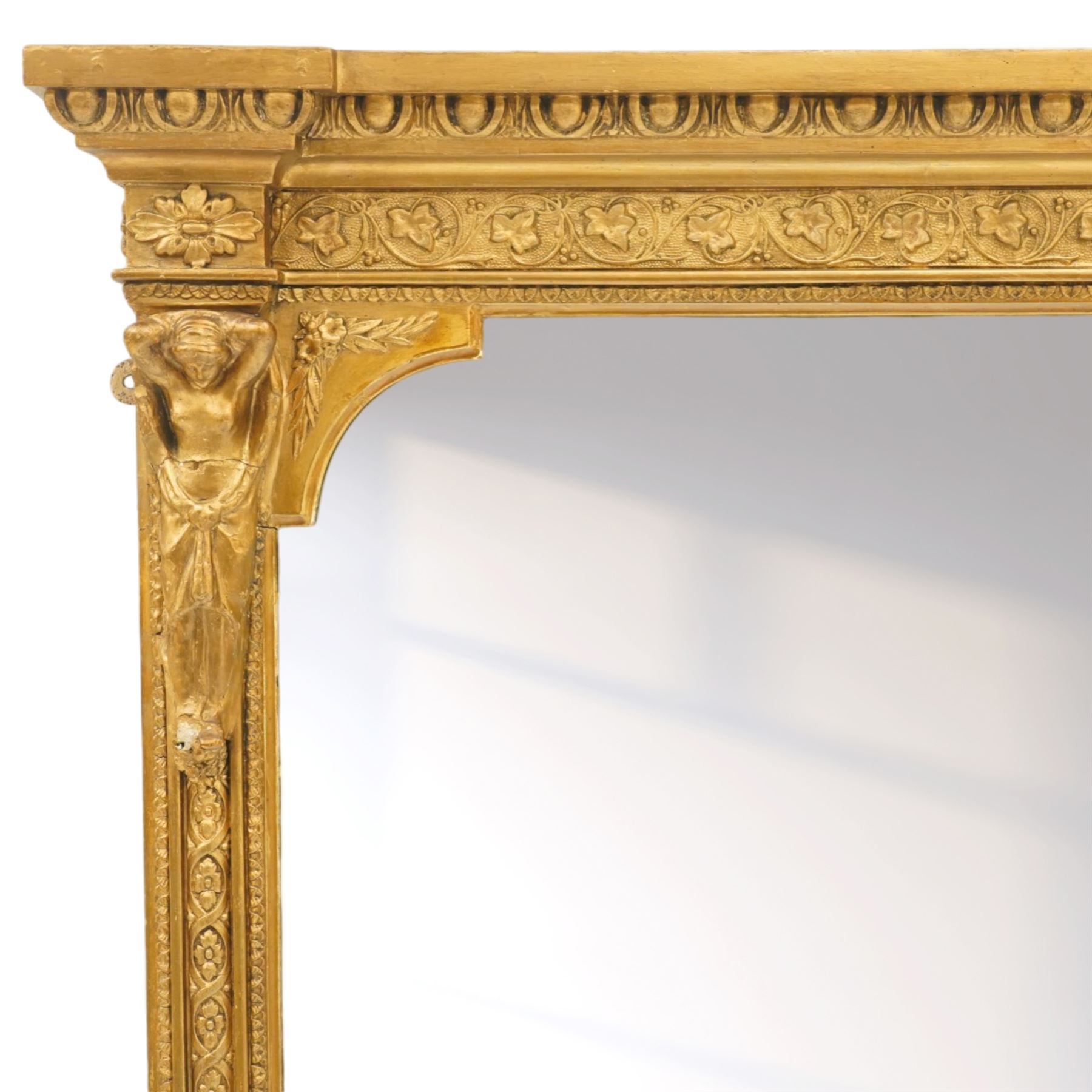 Large Victorian giltwood and gesso pier mirror, plain rectangular mirror plate enclosed by moulded frame with egg-and-dart cornice, foliate frieze and classical caryatid uprights, the lower corners decorated with scrolling acanthus, on shaped plinth base