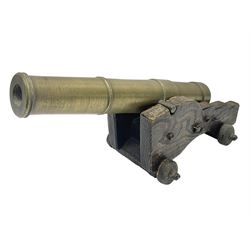 Table top brass cannon,  upon wooden base, together with three framed displays of Oriental decorative items, cannon tallest point H15cm