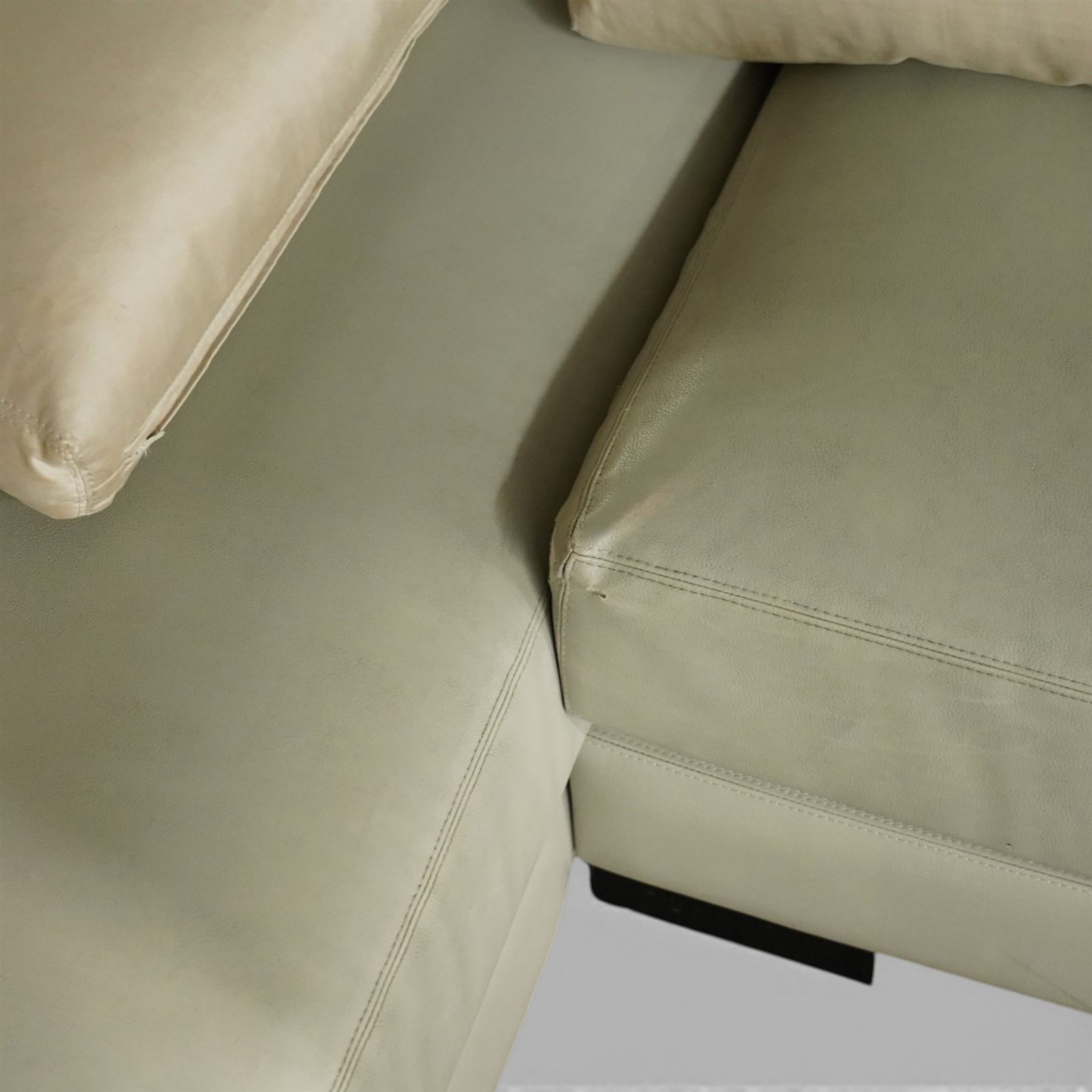 Christian Liaigre (1943-2020) - 'Arpege' handmade L-shaped sectional sofa, upholstered in neutral leather, with broad squared arms, deep seat cushions, angled chaise section, loose back cushions, raised on block feet