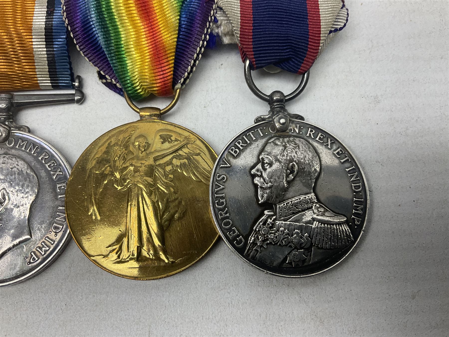 WW1 British Royal Navy Campaign and Royal Naval Fleet Reserve Long Service and Good Conduct group of five medals comprising British War Medal, 1914-15 Star and Victory Medal awarded to SS.113274 J.W. Baines Sto.1 R.N.; Naval general Service Medal to J.W. Baines Sto.1 N.B.; and Royal Fleet Reserve Long Service and Good Conduct Medal to SS.113274 (Dev. B.7397) J.W. Baines Sto.1 R.F.R.; all with ribbons