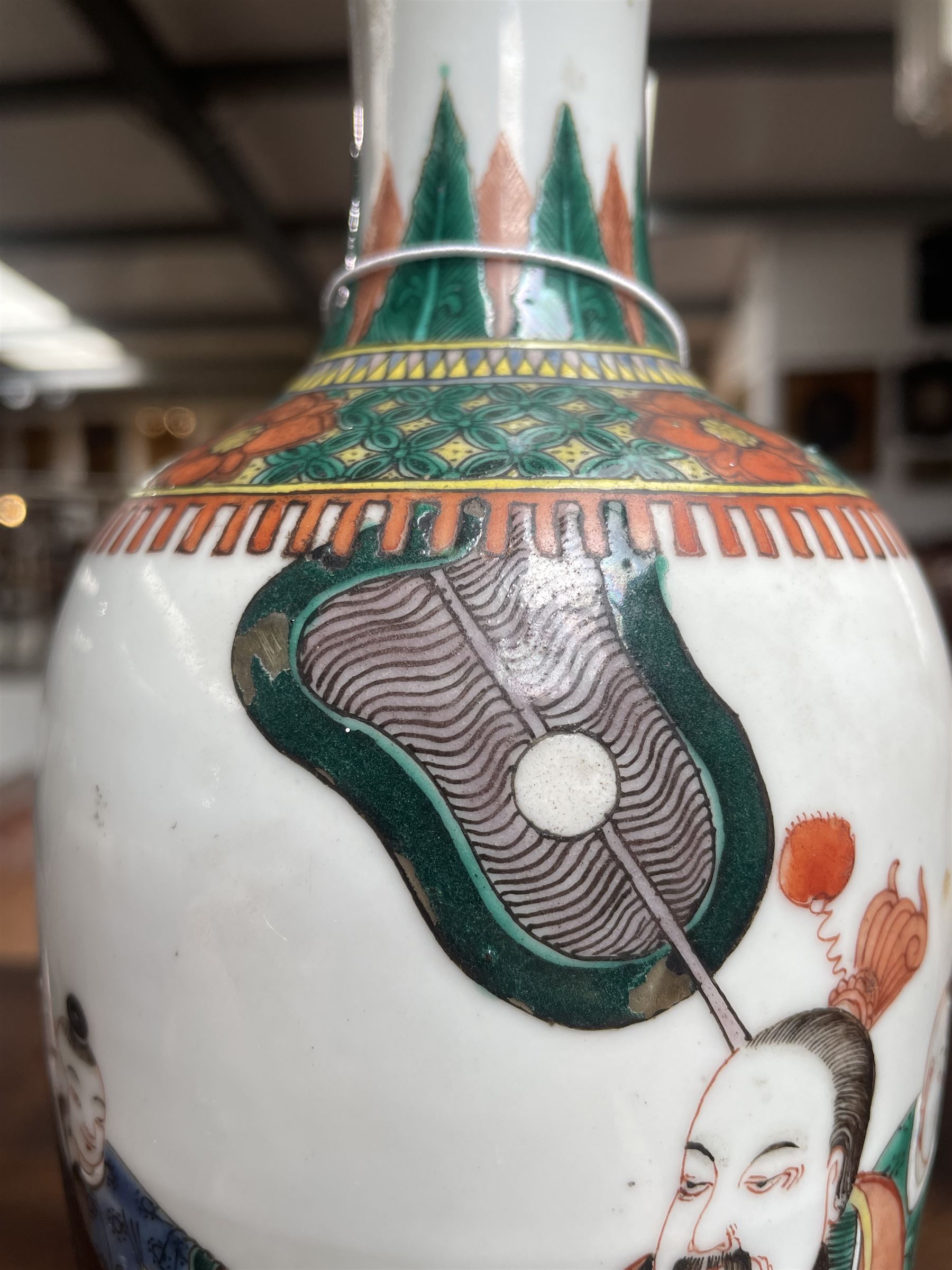 Chinese Kangxi famille verte vase of baluster form with fluted rim, decorated with sage and attendants within a trellis border, with four character Kangxi double ring mark beneath, H31cm 