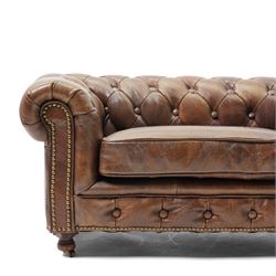 Miniature brown leather button back Chesterfield sofa, with castors 