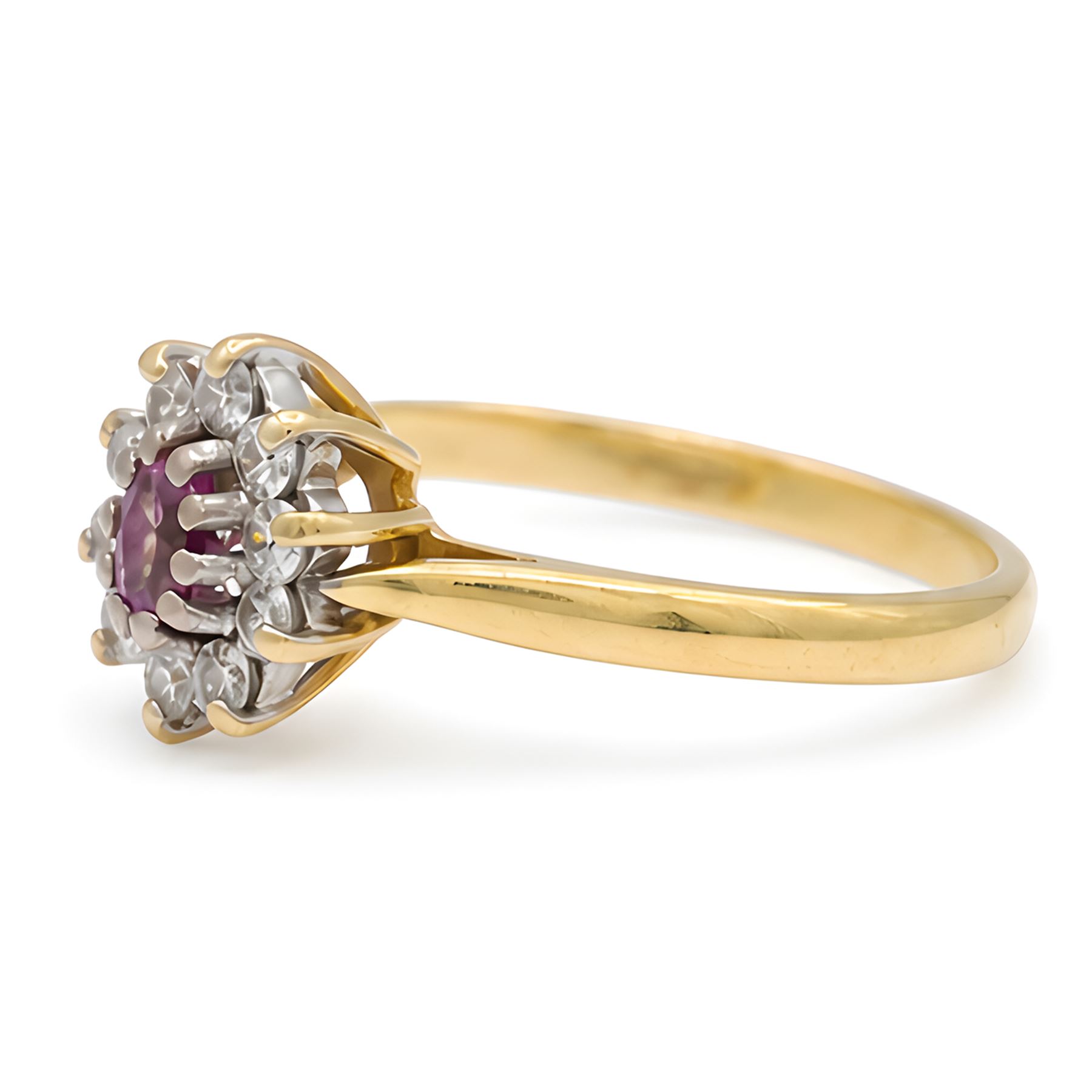 18ct gold pink sapphire and diamond cluster ring, single oval cut sapphire of 0.23 carat, surrounded by ten round brilliant cut diamonds, Birmingham 1985, total diamond weight 0.26 carat