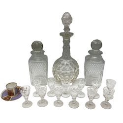 Pair of square sided cut glass decanters and stoppers, together with another cut glass example, twelve liquor glasses, and a Continental coffee can and saucer, transfer print decorated, in one box 
