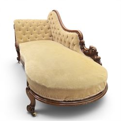Victorian mahogany chaise lounge, scrolled back rest with deep buttoned back, upholstered in beige velvet, raised on a carved frame raised on cabriole supports terminating in castors 