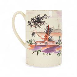 18th century Leeds creamware mug, circa 1770, of cylindrical form with curved strap handle, painted in purple, red and green with a peasant toasting with a glass of ale within a bucolic setting, H12.5cm