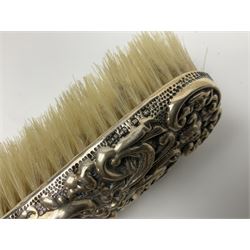 Three silver mounted dressing table brushes, all hallmarked