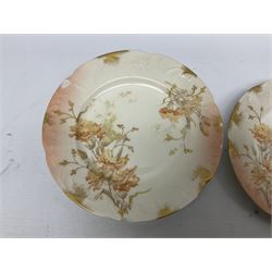 Early 20th century Limoges part tea service, decorated with floral sprays and gilt on merging peach and white ground, comprising six teacups, twelve side plates, six smaller plates, milk jug, open sucrier, slop bowl and two cake plates, many marked R Delinieres Limoges D&C France to base