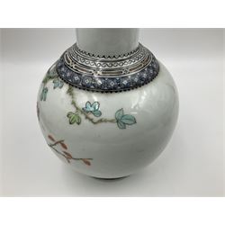 Pair of Chinese Republic porcelain vases, each painted in Famille Rose enamels with pairs of pigeons amidst peony, rock, flowering plants and leafy branches, possibly Qianlong seal beneath, H22cm 