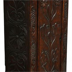 Man Beckett (I) of Stockton on Tees (Co Durham) - 8-day early 18th  century longcase clock in a  profusely carved oak case, with a caddy top, turned finials and attached barley twist pilasters to the break arch hood door, long trunk with carving and a conforming long rectangular door carved with a Celtic depiction of the tree of life, corresponding plinth with a carved and decorative base, break arch brass dial with a rounded brass surround, cast spandrels and silvered boss with the makers name to the arch, matted dial centre with seconds dial, ringed winding apertures, square date aperture and fettled steel hands, silvered chapter with Roman numerals, five minute Arabic's, half hour markers, minute and inner quarter hour tracks, dial pinned to a five pillar movement with inside countwheel striking and a recoil anchor escapement, striking the hours on a bell. With weights and pendulum.
Man Beckett (I), (first name is a biblical name short for Manasseh), was the first member of the Beckett family of prodigious clockmakers working in the North-East of England from 1720 until 1884.