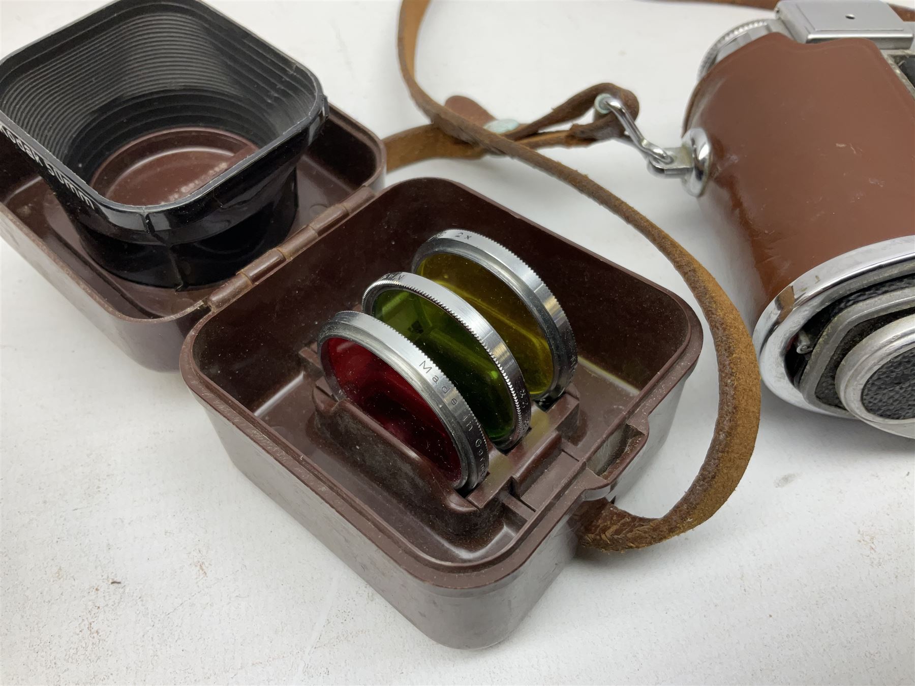 Kodak Retina III camera with 'Schneider-Kreuznach 3977724 Retina-Xenon C f:2/50mm' lens in leather case, and Brownie Model D in leather case