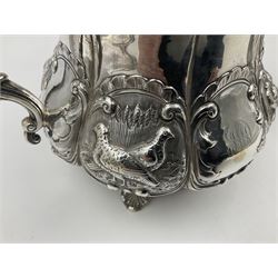 Victorian silver three piece tea service, comprising teapot, twin handled open sucrier, and milk jug, each of bellied form with acanthus capped scroll handles, the sides embossed with alternating scroll edged vacant panels and panels containing a pair of birds, upon four palmette feet, the teapot with ivory insulators to handle, and bird finial to the hinged domed cover, hallmarked William Hunter & Son, London 1861, teapot H19cm, including handles sucrier H13.5cm, including handle milk jug H12cm

This item has been registered for sale under Section 10 of the APHA Ivory Act