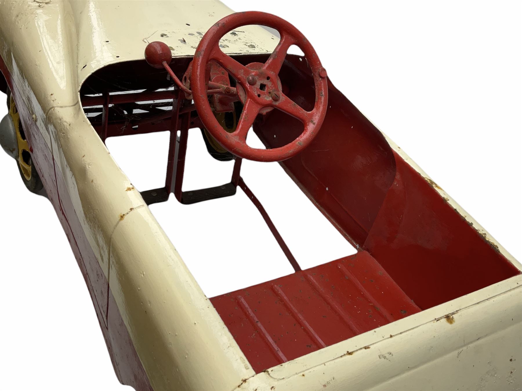 1950s child's tin-plate pedal car, possibly by Tri-ang, painted white and red and named 'Crusader' L104cm