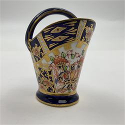 Group of Crown Derby and Royal Crown Derby Imari pattern miniatures, including mid 19th century Stevenson and Hancock cauldron, with painted mark beneath, H5.5cm, a near pair of early Royal Crown Derby scuttles, decorated in the 6299 pattern, each with printed and painted marks beneath including illustration date codes for 1913 and 1922, tallest 6.5cm, and a further early 20th century Royal Crown Derby scuttle, decorated in the 6299 pattern, with printed and painted marks beneath including illustration date code for 1922, H5.5cm, (4)
