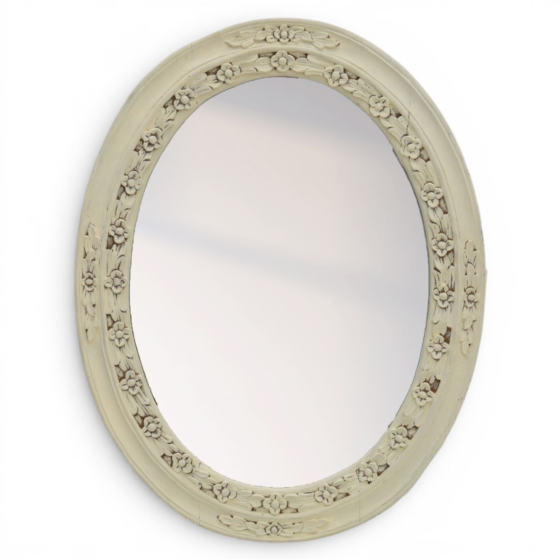 Oval painted pine wall mirror, with carved stepped edge, with mounts for hanging