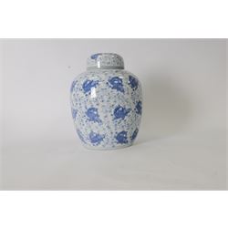 Blue and white ginger jar, decorated in a repetitive pattern of fish swimming amongst dense clusters of aquatic foliage, H40cm