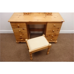  Pine kneehole dressing table, eight drawers on bun feet (W127cm, H77cm, D51cm) with stool (2)  