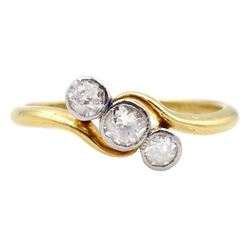 Early-mid 20th century gold old cut three stone diamond crossover ring, stamped 18ct, total diamond weight approx 0.30 carat