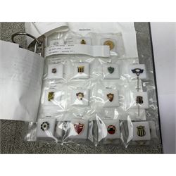 Large collection of approximately one hundred and eighty enamel badges and pins, relating to British and World football clubs, including loose examples and examples housed in folders, mostly identified