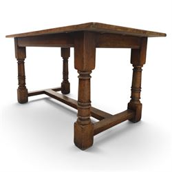 Titchmarsh & Goodwin style solid oak refectory table, rectangular top raised on block and turned supports united by a full length undertier