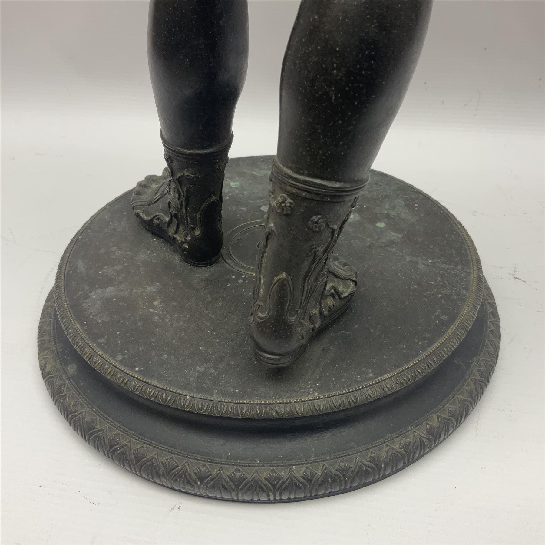 Bronzed classical nude male figure, upon a stepped circular base, H61cm 