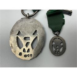 Victoria Volunteer Officers’ Decoration, V.R. cypher, hallmarked silver London 1892, with integral top riband bar and ribbon, unnamed; the matching miniature; and Victoria 'For Long Service in the Volunteer Force' miniature medal with ribbon in original case (3)