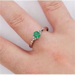 9ct white gold oval emerald and diamond ring