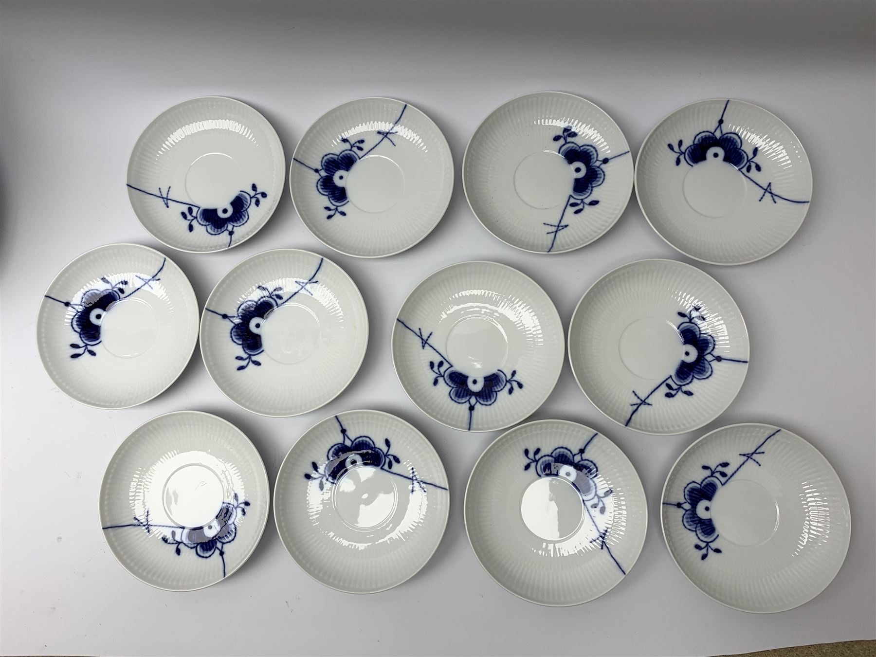Royal Copenhagen tea and dinner service for twelve place settings, decorated in the Mega Blue Fluted pattern, pattern number 622, comprising dinner plates, salad plates, bowls with pierced rim, smaller bowls, tea cups, and saucers, dinner plates D27.5cm, salad plates D22cm