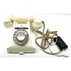 Vintage cream Bakelite telephone, with chrome dial, pull out number tray and plaque inscribed Recall, H15cm.