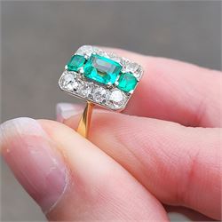 Early 20th century gold emerald and diamond panel ring, three octagonal cut emeralds, with four old cut diamonds set either side, stamped 18ct Plat, total diamond weight approx 0.85 carat