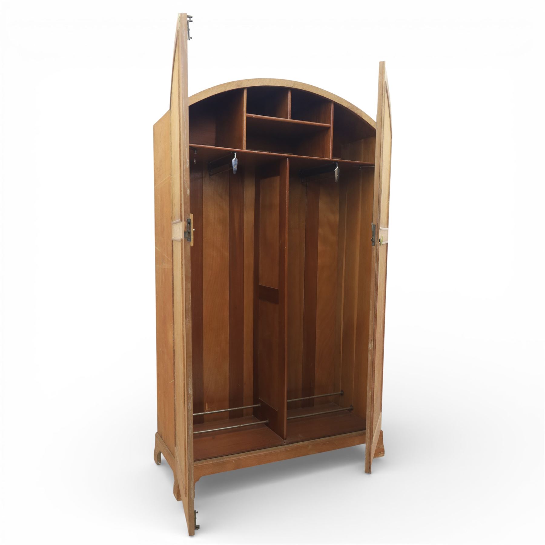 Early 20th century Art Deco bedroom suite, comprising double wardrobe, dressing table and chest of drawers, constructed in walnut with figured veneers and geometric banding, the wardrobe with arched top and panelled doors enclosing a fitted interior, the dressing table with rectangular top below a three panel mirror arrangement, fitted with two short over two long drawers, the chest with three short and three long drawers, each piece fitted with faceted handles and raised on shaped feet
Wardrobe (H 177cm, D 46cm, W 112cm)
Chest (H 85cm, D 48cm, W 92cm)
Dressing table (H 160cm, D 52cm, W 106cm)
