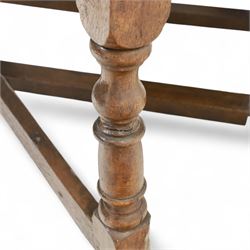 Early 19th century oak drop-leaf gateleg table, oval top above plain frieze, on ring turned legs joined by stretchers