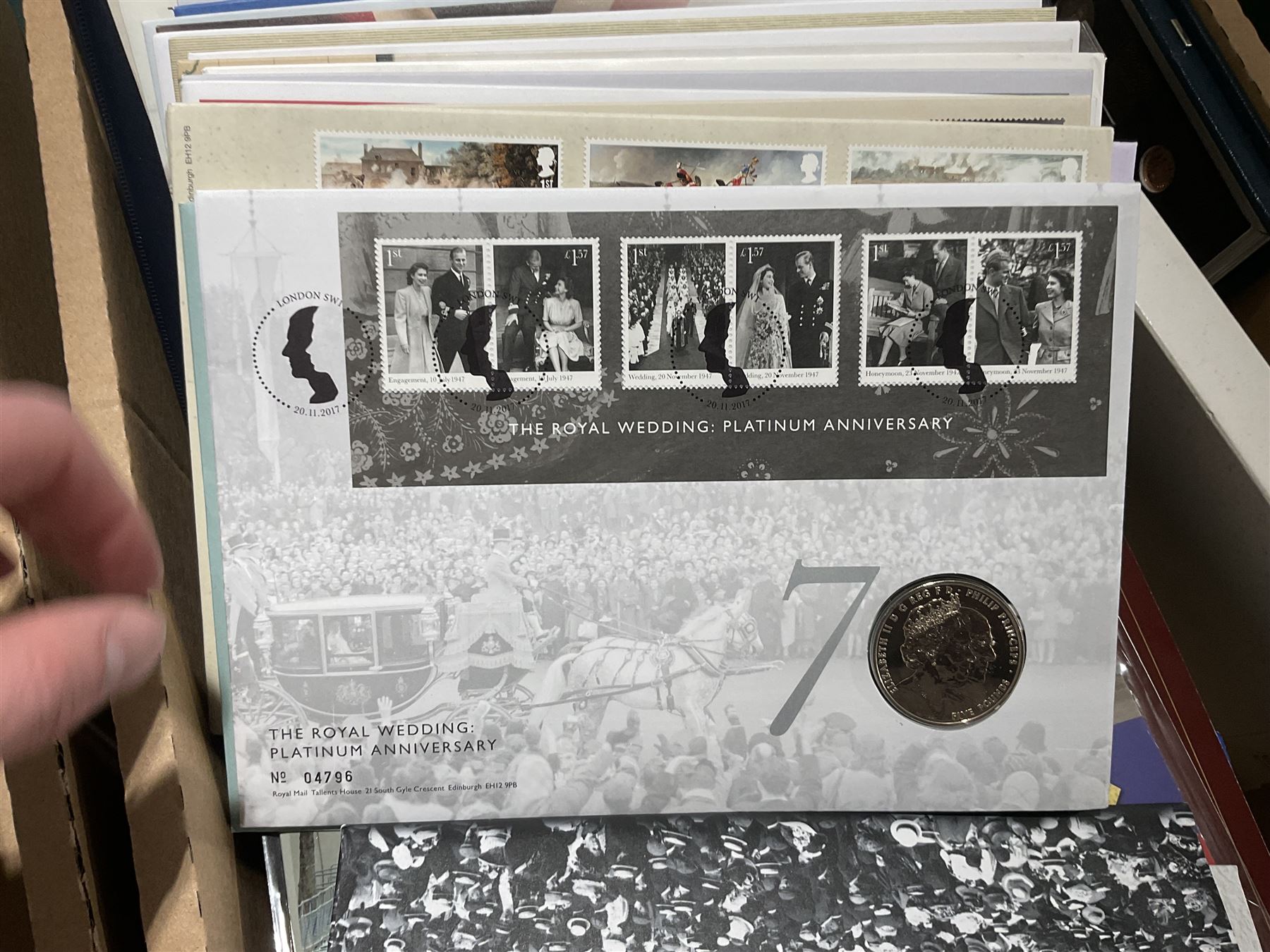 Approximately one hundred and fifteen Royal Mint coin covers, in two ring binder folders and loose, together with approximately 53 grams of Great British pre-1920 and approximately 68 grams of Great British pre-1947 silver threepence coins, and a small quantity of further pre-decimal coins