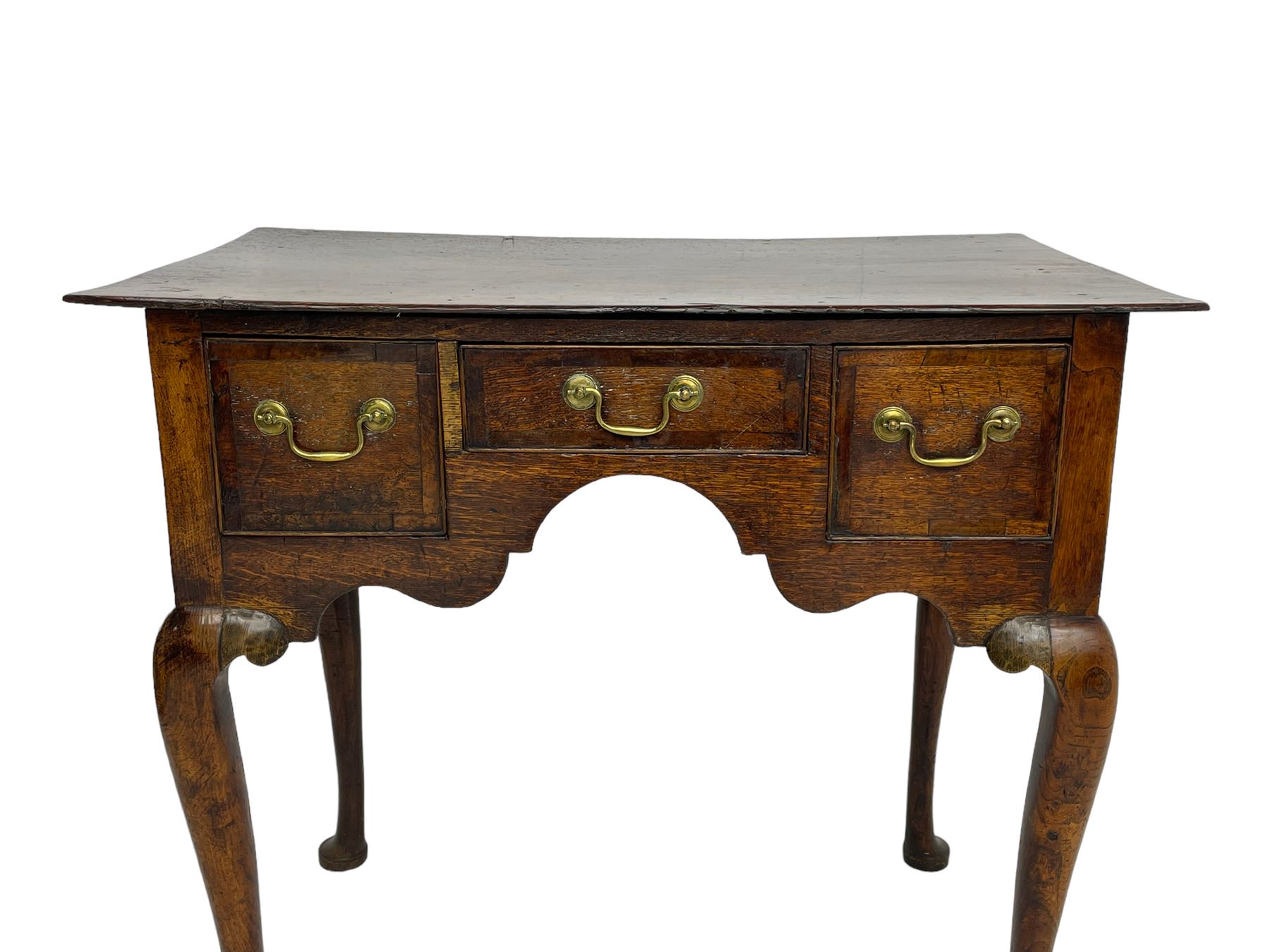18th century oak low-boy, rectangular top over three crossbanded and cock-beaded drawers, ogee and stepped arch apron, on cabriole supports 