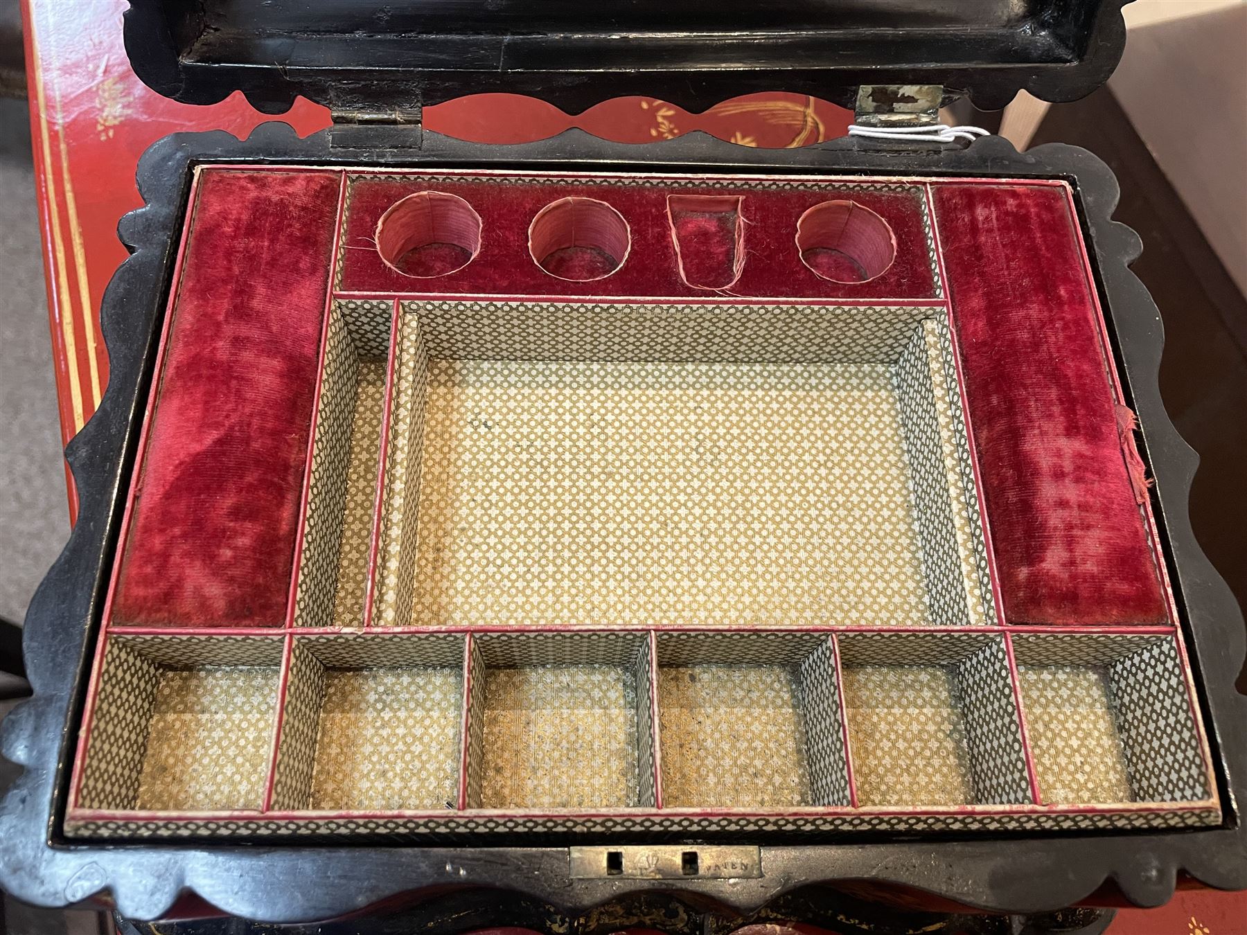 Victorian black lacquered papier-mâché sewing box, of rectangular form with shaped sides, the slightly domed top with inlaid mother of pearl and abalone decoration, the sides with gilt and polychrome painted scrollwork, the hinged cover opening to reveal a fitted interior with lift out tray, H14cm