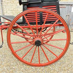 Holland & Holland Tandem Cart - Althorp Spencer Family Estate

A two wheeled tandem cart or cocking cart by Holland & Holland Coach Builders, London, with black painted bodywork, red painted shafts and running gear, red wooden spoked wheels with rubber tyres, green upholstered seating and a rear perforated metal footboard. The cart is fitted with carriage lamp brackets (lamps next lot), green buttoned cushions with leather retaining straps, side louvered body panels, footrests, leaf spring suspension and shafts for horse use. The carriage incorporates an adjustable body position, operated by a lever, allowing the body to be moved forwards or backwards to alter the weight distribution. Formerly owned by the family of Lady Diana Spencer,
Sympathetically conserved by Woods of Fairbourne Carriages Ltd, Kent.

Features:
• Brass maker’s plaque for Holland & Holland Coach Builders, London
• Two wheeled tandem cart
• Black painted body with red painted shafts and running gear
• Red wooden spoked wheels with rubber tyres
• Green upholstered cushions with leather retaining straps
• Adjustable carriage body for weight distribution
• Lever operated adjustment mechanism
• Perforated rear footboard
• Side footrests
• Louvered side panels
• Leaf spring suspension
• Rear opening storage compartment
• Decorative painted armorial motif to rear panel
• Fitted carriage lamps shown, not included in the lot (available as next lot)
• Conserved by Fairbourne Carriages Ltd
• Provenance: The Althorp Attic Sale including The Spencer Carriages, lot 195, 7 July 2010

Dimensions:
Overall length 396 / 198cm
Width 155cm
Height 190cm

Wheel Diameters:
Wheels: 148cm

Seating:
Driving seats: 2
Passenger seats: 2