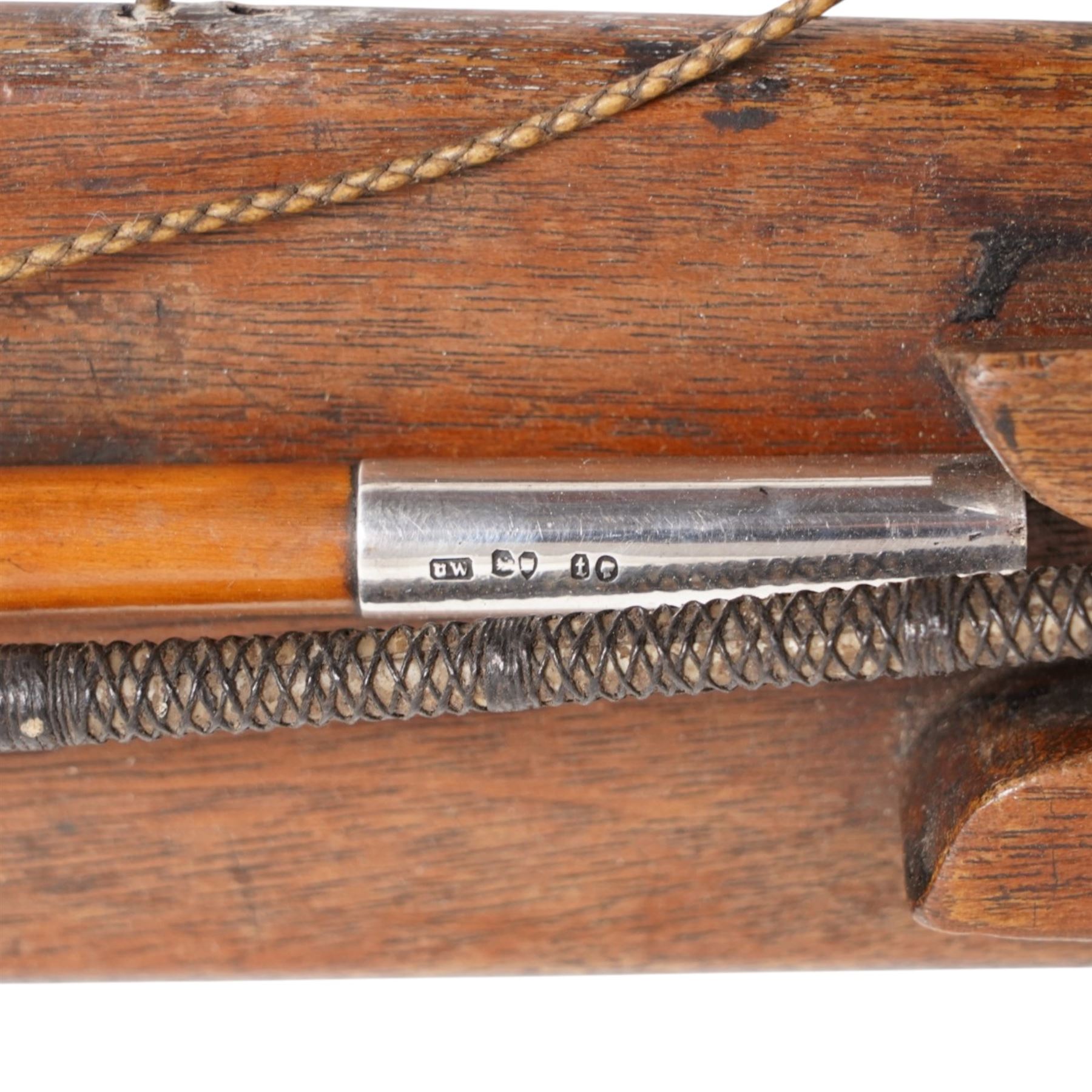 Callow & Son - 19th century travelling coaching whip, the two part yew wood shaft, with silver collars and butt end, hallmarked U & T Walker, London, with leather handle, upon a Callow & Son mount, whip L166cm 