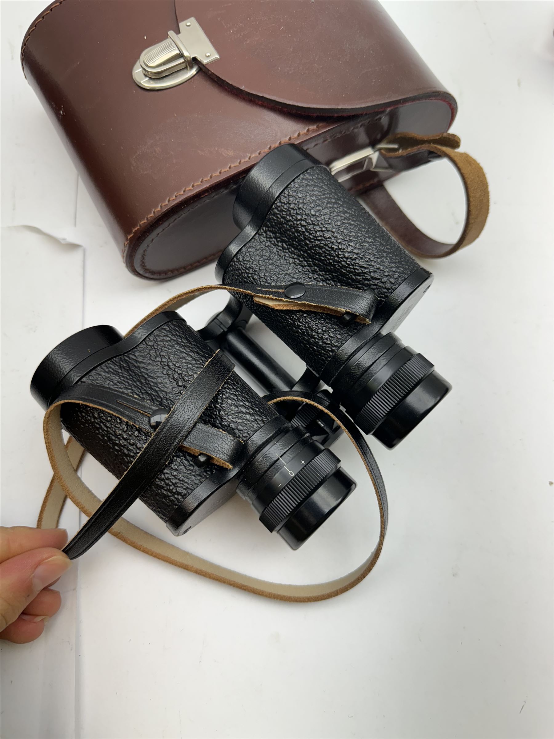 Four pairs of binoculars, to include Carl Zeiss Jena Jenoptem 8x30W serial no. 3750814, Nikon Sporting II 8x40 serial no. 604672, Minolta Pocket II 8x22 Field 7 and Jessops 12x25 Field 4.8 84m/1000m, all in carrying cases 
