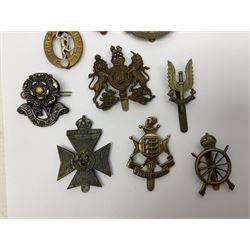 Twenty-three regimental and corps cap badges including Northern Cyclists Battalion, 5th Cinque Ports Battalion, Rifle Brigade, North Riding Rifle Volunteers, Artists Rifles, Finsbury Rifles, REME, RAC, Signals, Catering, Education, Pay, Dental Corps etc ; and an ARP hallmarked silver badge (24)