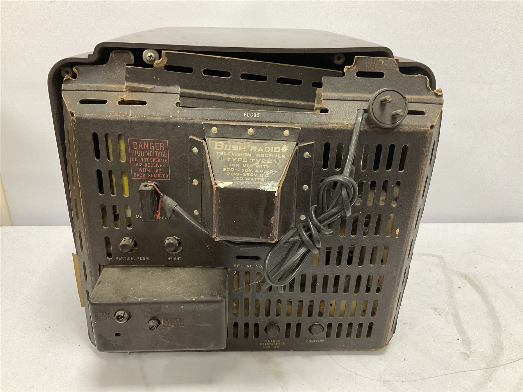 1950s Bush Type TV22 Bakelite Television receiver, the TV cased in marbled brown Bakelite of stepped form, the 9 inch screen with white mask, with original leather cover casing to reverse, H39cm D34cm W38cm