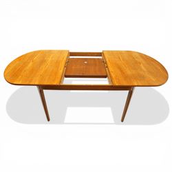 Nathan - teak oval extending dining table, together with set of eight matching low-back dining chairs with tan leather seats, extends to 203cm