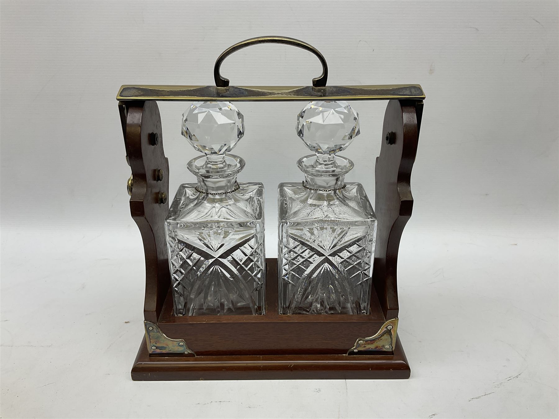 Late 20th century mahogany and silver plated two cut glass decanter tantalus, marked PB&S, with Whisky and Gin Crown Staffordshire ceramic decanter labels, H32cm