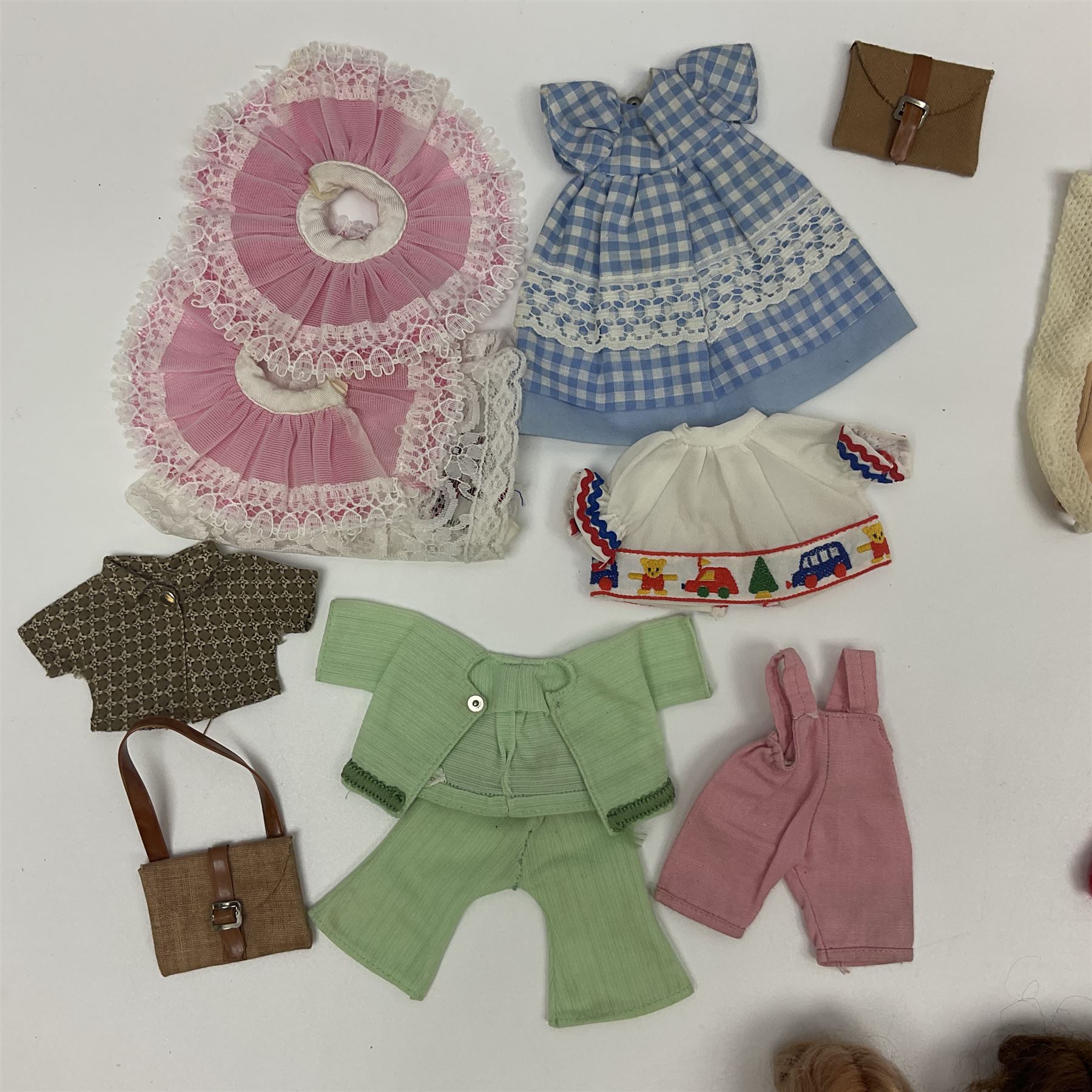 Six fashion dolls by Amanda Jane, Sindy and Barbie with various outfits, clothing and footwear