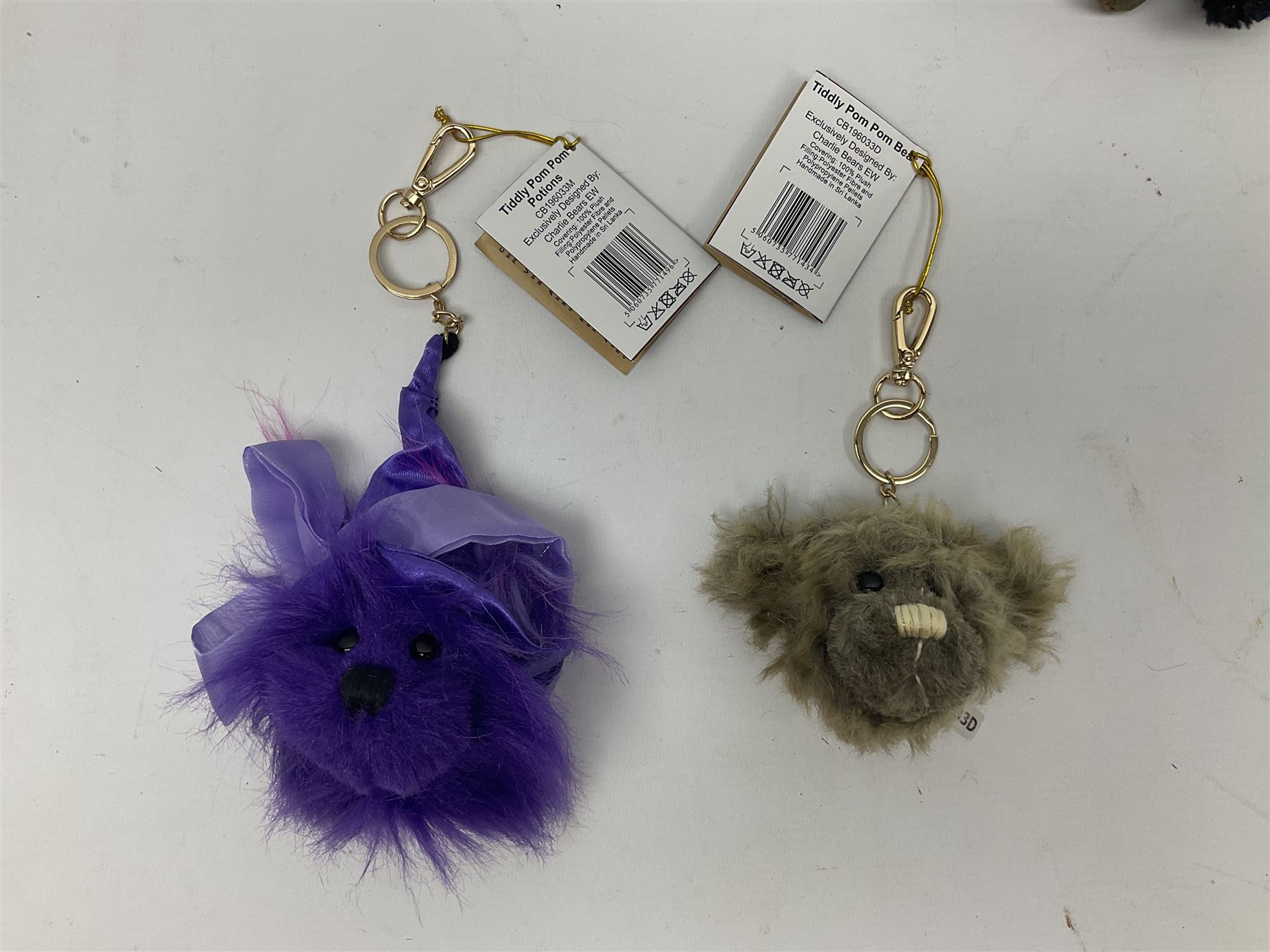 Five Charlie Bears Plush Hug Book Collection books, comprising Guide To Snuggleability containing Snuggleability CB191971F, Paw-Some Facts Directory containing Pawsome CB191971D, Bear Therapy Handbook containing Bear Therapy CB191971E, Study Buddy Handbook containing Study Buddy CB191971A, and Guide to Being Bear-illiant CB191971B, each designed by Isabelle Lee, each with tags, plus Charlie Bears Secret Hug Book (lacking contents), together with assorted Charlie Bear accessories, to include two Bear Ears Duffle headbands CBBEARSDUF, Egg Cup CB185198 , Incy Wincy CB205252AO, with tag, four key rings, all with tags, Bear Care Kit and contents, recipe cards, pin badges, tape measure, notebook, etc., (Qty)