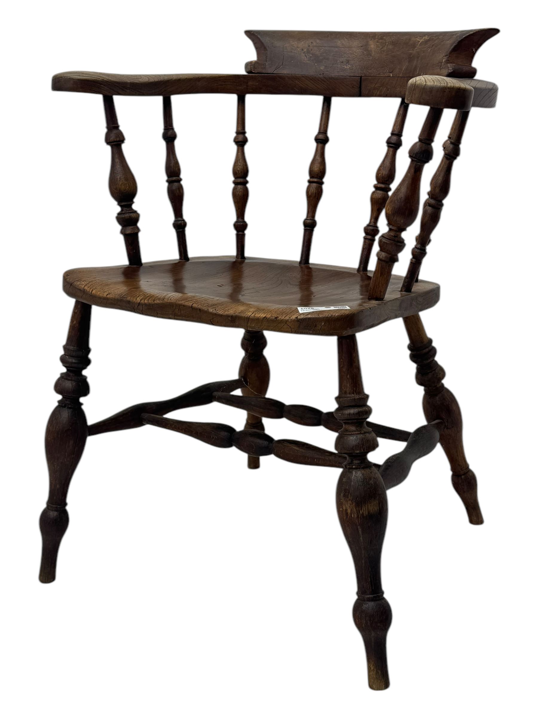 19th century elm and beech smoker's bow armchair, shaped arms over turned spindle gallery and dished seat, on turned supports united by double H-shaped swell turned stretchers 