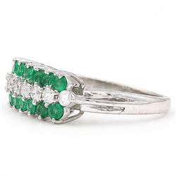 18ct white gold three row diamond and emerald ring, set with eight round brilliant cut diamonds and a row of seven emeralds set either side, total diamond weight approx 0.30 carat