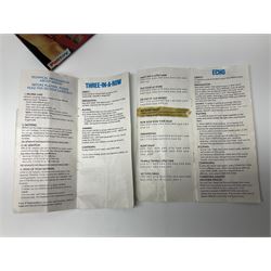 Three late 70s/early 80s handheld electronic games; Bandai Electronics Arcade ‘Gunfighter’ (1980), Grandstand ‘Invader From Space’ (1980), Palitoy ‘Merlin The Electronic Game Machine’ (1979) with game sheet and instruction booklet, all with original boxes (3) 